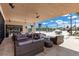 Stunning clubhouse featuring an outdoor lounge area with multiple seating and table arrangements at 7540 Brooklyn Dr, Kissimmee, FL 34747
