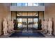 The grand entrance of the community center at Magic Village Views with security and a luxury design at 7540 Brooklyn Dr, Kissimmee, FL 34747