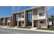 View of modern townhouse row, showcasing contemporary design with clean lines and large windows at 7540 Brooklyn Dr, Kissimmee, FL 34747