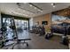 Modern gym featuring state-of-the-art cardio machines, free weights, and floor-to-ceiling windows at 7540 Brooklyn Dr, Kissimmee, FL 34747