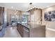 Modern kitchen with an island that overlooks the living area at 7540 Brooklyn Dr, Kissimmee, FL 34747