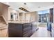 Open kitchen design featuring a large island with sink and modern finishes at 7540 Brooklyn Dr, Kissimmee, FL 34747