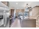 Modern kitchen with stainless steel appliances, large island, and wood cabinets at 7540 Brooklyn Dr, Kissimmee, FL 34747