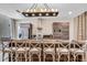 Contemporary kitchen featuring a large island with seating and modern lighting at 7540 Brooklyn Dr, Kissimmee, FL 34747