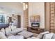 Open living space featuring a modern fireplace, TV, and cozy seating arrangement at 7540 Brooklyn Dr, Kissimmee, FL 34747