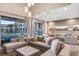 Bright living room features stylish couches, modern lighting, and seamless indoor-outdoor living at 7540 Brooklyn Dr, Kissimmee, FL 34747