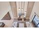 Modern living room featuring a stone accent wall, pendant lighting and comfortable seating at 7540 Brooklyn Dr, Kissimmee, FL 34747