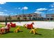 Wonderful playground area features colorful animal figures and soft, artificial turf at 7540 Brooklyn Dr, Kissimmee, FL 34747