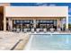 The zero entry community pool has lounge chairs and a community center at Magic Village Views in Orlando at 7540 Brooklyn Dr, Kissimmee, FL 34747
