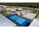 A beautiful tennis court with beach volleyball and pool in the resort-style community of Magic Village Views at 7540 Brooklyn Dr, Kissimmee, FL 34747