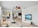 Comfortable living room with stylish furnishings and open floor plan to dining and kitchen at 113 Grand Reserve Ct, Davenport, FL 33837