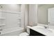 Full bathroom featuring a shower-tub combo, single sink with quartz countertop, and modern fixtures at 1667 Ruby Ln, Lake Alfred, FL 33850