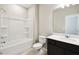 Full bathroom featuring a shower-tub combo, single sink with quartz countertop, and modern fixtures at 1667 Ruby Ln, Lake Alfred, FL 33850