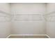 Spacious walk-in closet with ample storage space, featuring wire shelving, perfect for organization at 1667 Ruby Ln, Lake Alfred, FL 33850