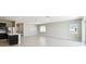 Large and open living room with tile floors and open concept layout with lots of light from sliding door at 1667 Ruby Ln, Lake Alfred, FL 33850