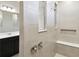Newly tiled shower with a built-in seat, niche, and chrome fixtures for a spa-like experience at 1667 Ruby Ln, Lake Alfred, FL 33850