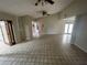 Spacious living area featuring vaulted ceiling, tile flooring, ceiling fan, and natural light at 1880 N Crystal Lake Dr # 65, Lakeland, FL 33801
