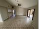 Open living room featuring tile flooring, a ceiling fan, and sliding glass doors at 1880 N Crystal Lake Dr # 65, Lakeland, FL 33801