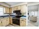 Well-equipped kitchen showcasing modern appliances and wooden cabinetry at 21 Cedar Dr, Davenport, FL 33837