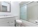 Bathroom featuring a shower with glass doors, vanity, and toilet at 2639 Cayman Way, Winter Park, FL 32792