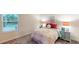 Cozy bedroom with carpeted floor, window and cute decor at 3217 Armstrong Ave, Clermont, FL 34714