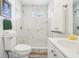Elegant bathroom features a tiled shower, modern fixtures, and ample lighting at 515 9Th St, Winter Garden, FL 34787