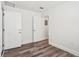 Bedroom featuring hardwood flooring and white doors at 515 9Th St, Winter Garden, FL 34787