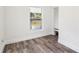 Charming bedroom with hardwood floors, natural light, and neutral colored walls at 515 9Th St, Winter Garden, FL 34787