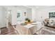 Bright dining area with hardwood floors and modern furnishings create an inviting atmosphere at 515 9Th St, Winter Garden, FL 34787