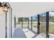 Home's screened front porch with metal gates at 515 9Th St, Winter Garden, FL 34787
