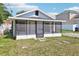 Charming home featuring a screened front porch at 515 9Th St, Winter Garden, FL 34787