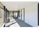 The home's front porch with white trim and beams and metal gates at 515 9Th St, Winter Garden, FL 34787