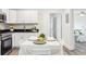 Bright kitchen area featuring modern appliances, sleek countertops, and an open dining setup for gatherings at 515 9Th St, Winter Garden, FL 34787