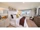 Serene bedroom with soft lighting, neutral colors, and comfortable furnishings for relaxation at 1010 Foreshore Ln, Haines City, FL 33844