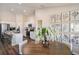 Inviting kitchen and dining area with modern appliances, white cabinets, and stylish decor at 1010 Foreshore Ln, Haines City, FL 33844