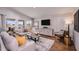 Bright living room with a modern design, neutral colors, and views of the outdoors at 1010 Foreshore Ln, Haines City, FL 33844