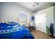 Comfortable bedroom with natural light, laminate floors, and double-door closet at 5118 Norriswood Dr, Mulberry, FL 33860
