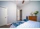 Bedroom with neutral walls, ceiling fan, and dark laminate floors at 5118 Norriswood Dr, Mulberry, FL 33860