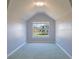 Bright bedroom with a large window offering natural light and a high vaulted ceiling at 5118 Norriswood Dr, Mulberry, FL 33860