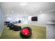 Bright bonus room with a large TV, and room to spread out and relax at 5118 Norriswood Dr, Mulberry, FL 33860