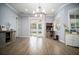 Dining area with hardwood floors and French doors leading to the backyard at 5118 Norriswood Dr, Mulberry, FL 33860