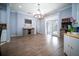 Dining area with hardwood floors, chandelier, and access to the backyard through French doors at 5118 Norriswood Dr, Mulberry, FL 33860