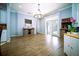 Dining area with hardwood floors, chandelier, and access to the backyard through French doors at 5118 Norriswood Dr, Mulberry, FL 33860