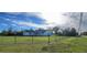 Spacious fenced-in yard with black perimeter fence, ideal for privacy and outdoor activities at 5118 Norriswood Dr, Mulberry, FL 33860
