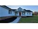 Charming home featuring a welcoming porch and a well-manicured lawn at 5118 Norriswood Dr, Mulberry, FL 33860