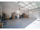 Spacious three-car garage with ample room for storage and vehicles at 5118 Norriswood Dr, Mulberry, FL 33860