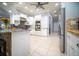 Spacious open kitchen with stainless steel appliances, white cabinetry, and tile flooring at 5118 Norriswood Dr, Mulberry, FL 33860