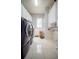 Modern laundry room with white cabinets, updated washer/dryer, and a large window at 5118 Norriswood Dr, Mulberry, FL 33860