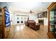 Inviting living room with hardwood floors, fireplace, and access to the backyard through French doors at 5118 Norriswood Dr, Mulberry, FL 33860