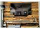 An entertainment center and electric fireplace is on a feature wall with rustic wood paneling at 5118 Norriswood Dr, Mulberry, FL 33860